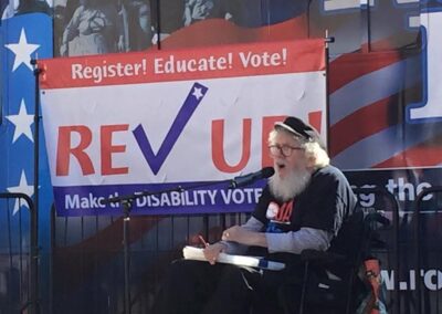 Bob Kafka sits in front of a Rev UP banner